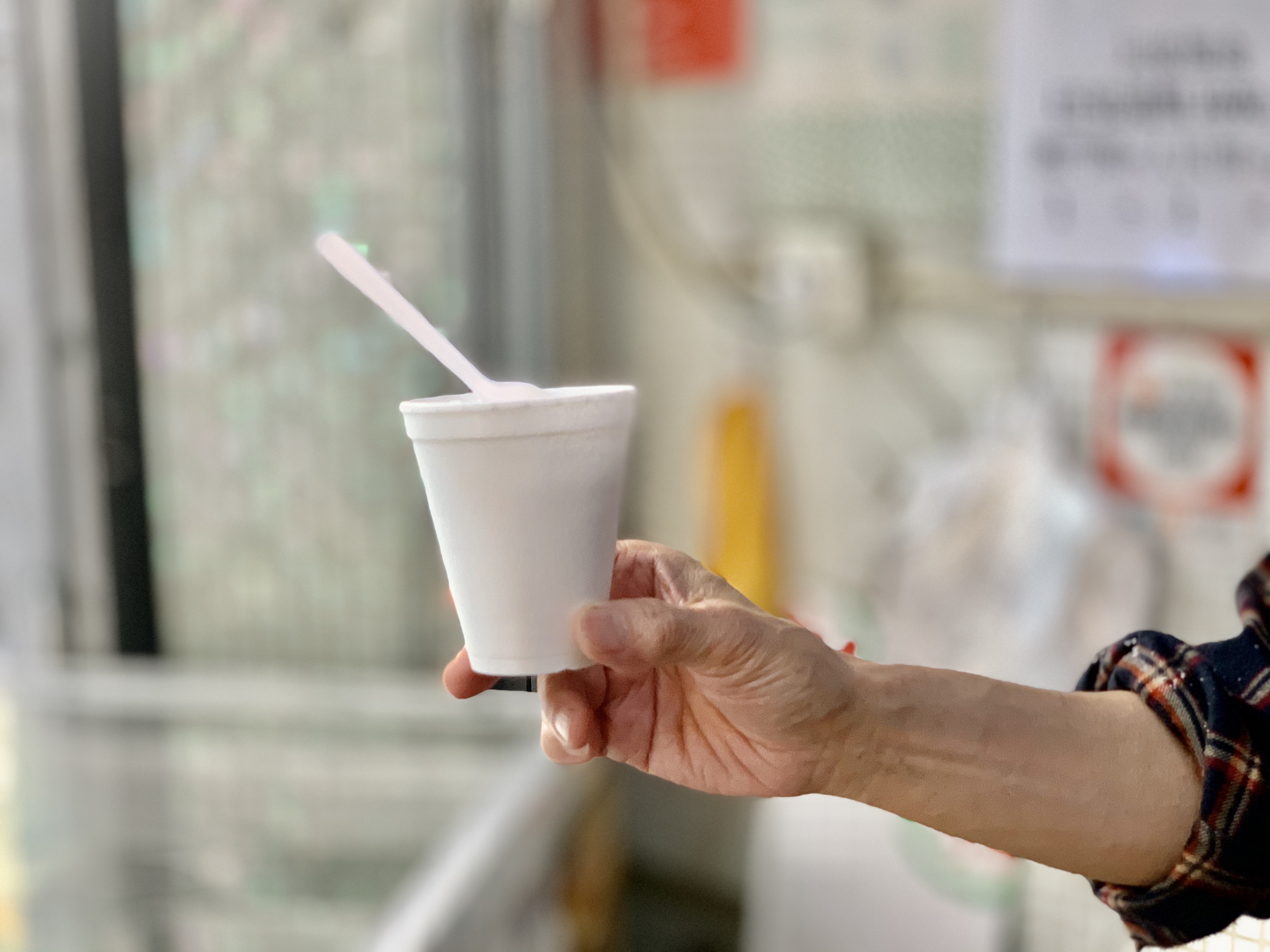 Cocos Hung Heng Owner Holding a Cup of Ice Cream Exterior Macau Lifestyle