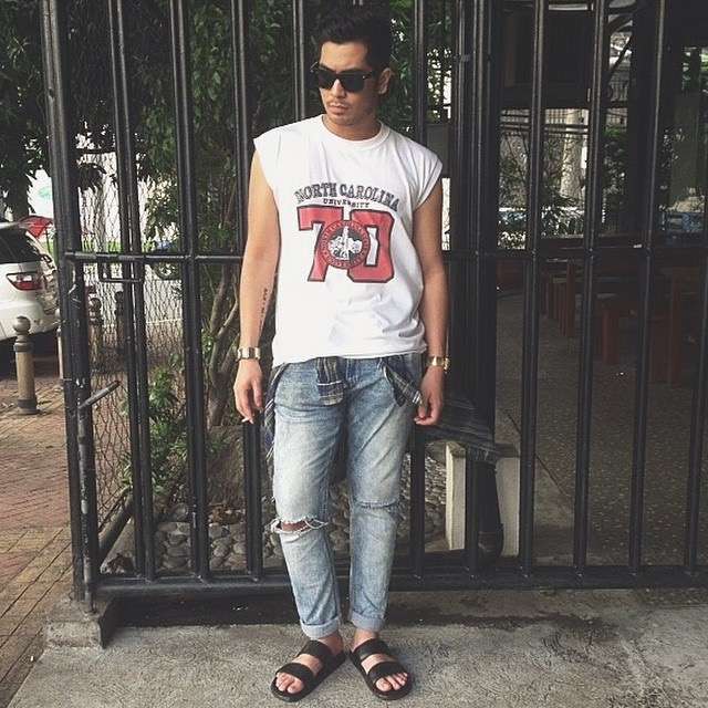 A young man wearing a t-shirtnd bluejeans