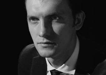 Black and white image of filmaker Max Bessmertny