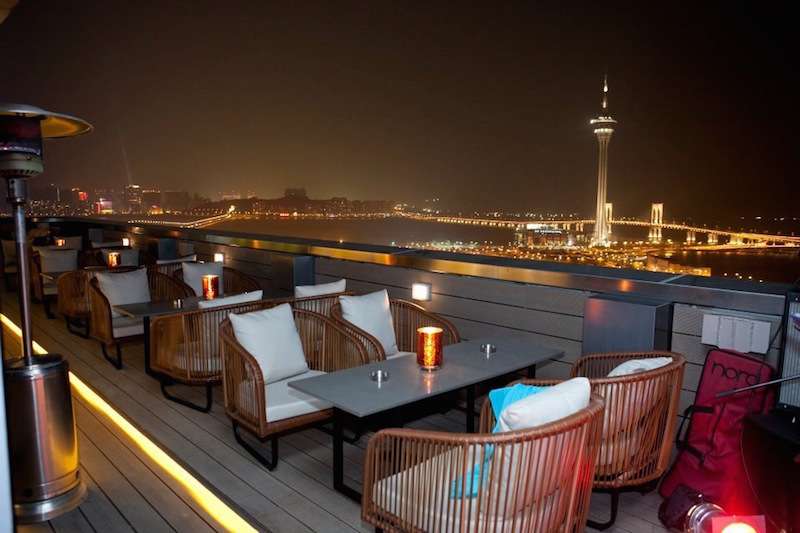 Sky 21 rooftop bar with view over Macau Tower