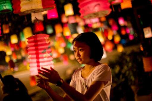 A girl holding a lantern