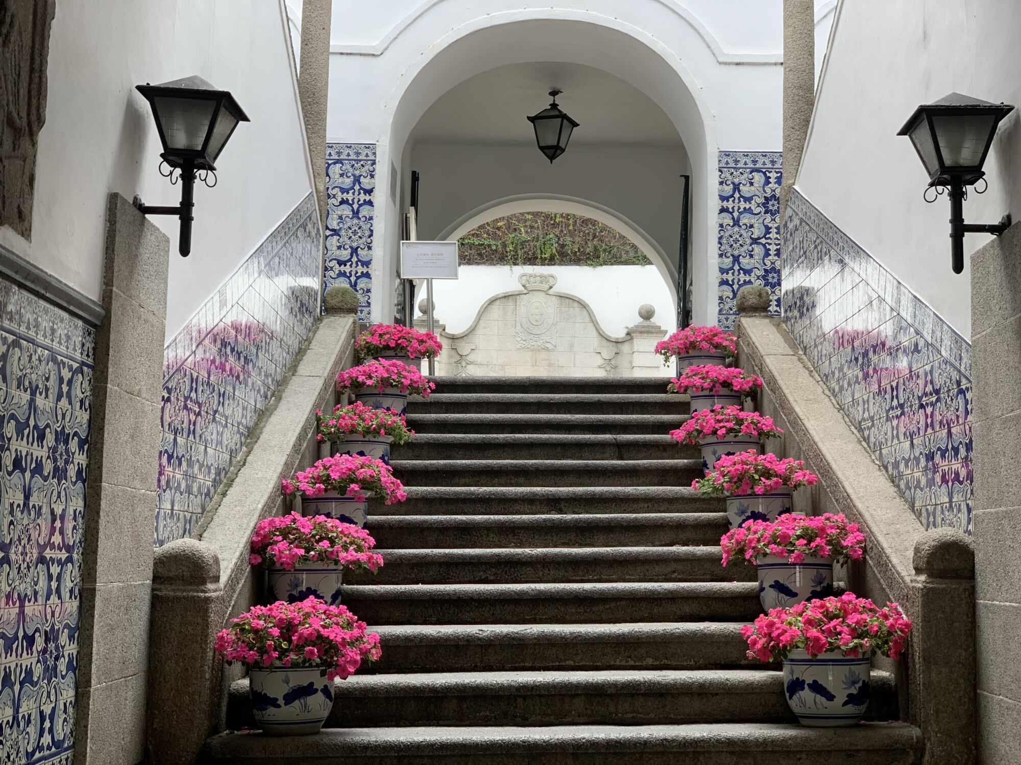 Leal Senado Building Entrance with Pink Flowers View from Below Macau Lifestyle