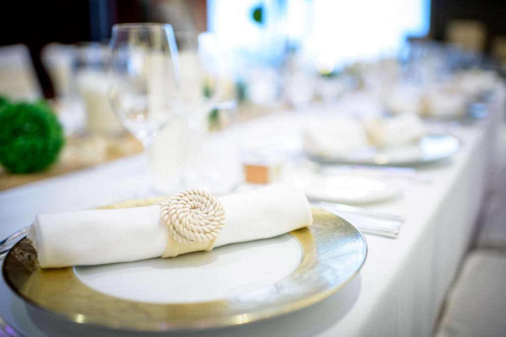 Closeup of white wedding party table settings at Mandarin Oriental Macau.