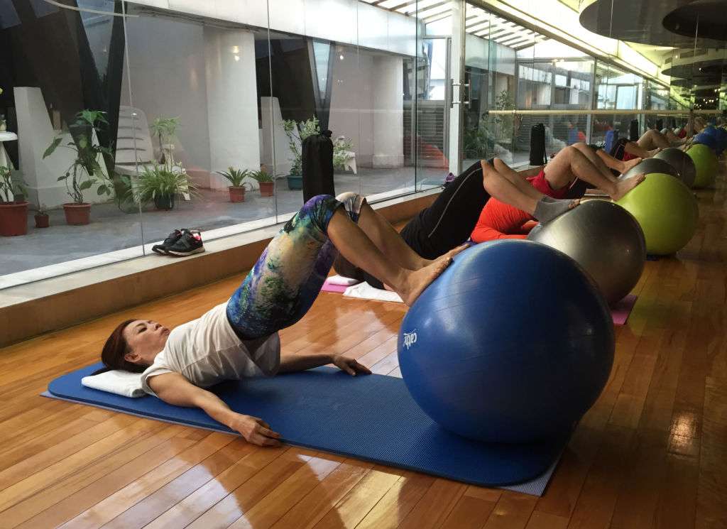 A group of people doing pilates