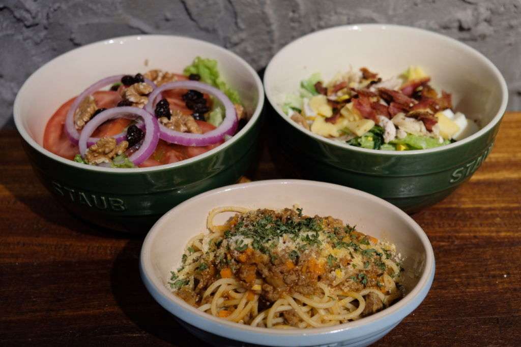 cobb salad, Italian-inspired bolognese pasta, and gnocchi with grilled mixed vegetables at Miss M Food restaurant in Macau