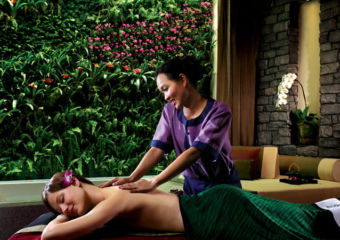 Woman receiving massage at Banyan Tree spa in Macau.