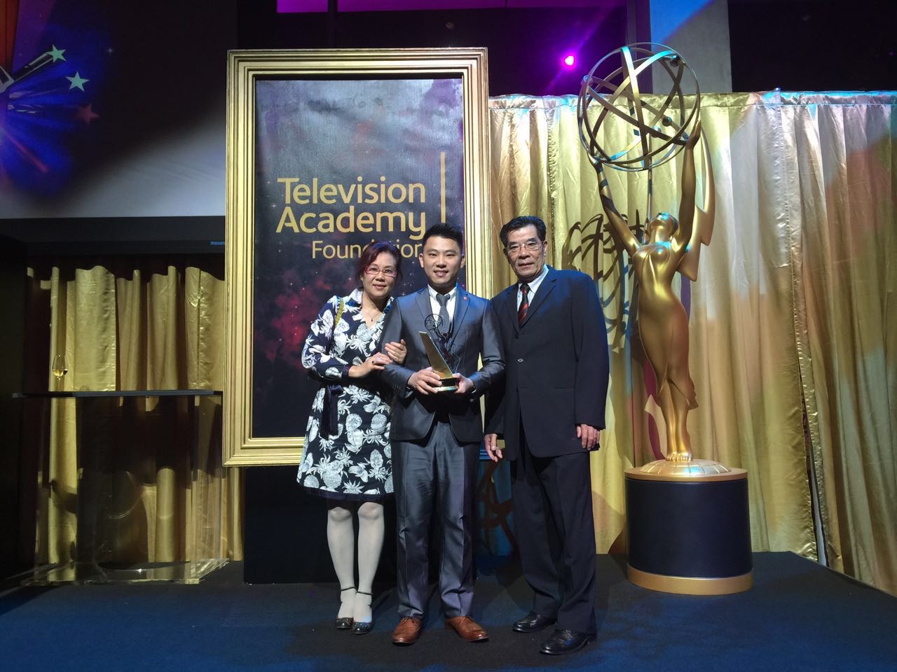 Filmmaker Cheok Lei posing with his award at the Television Academy