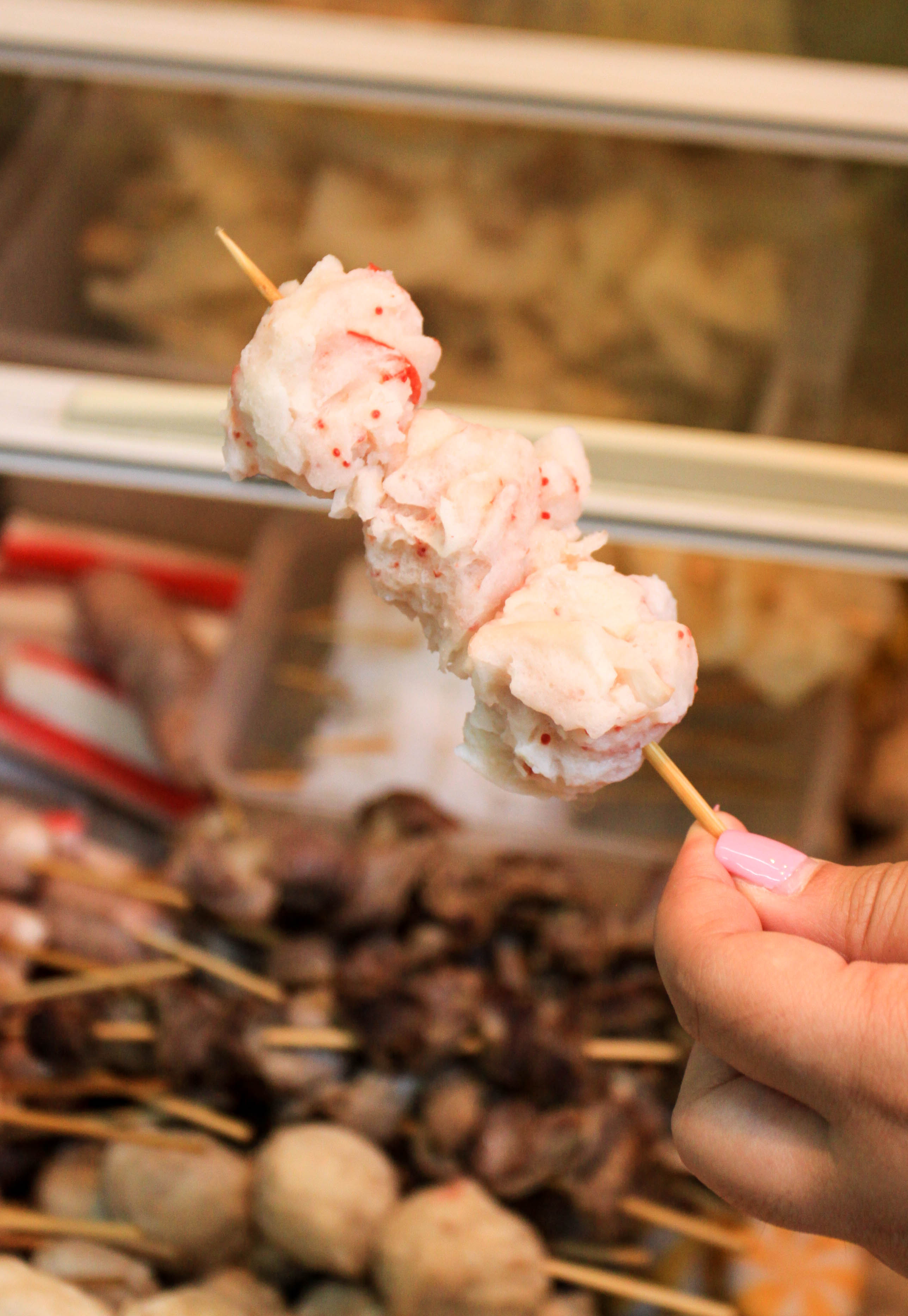 A skewer of lobster balls from a fishball stall in Macau. 