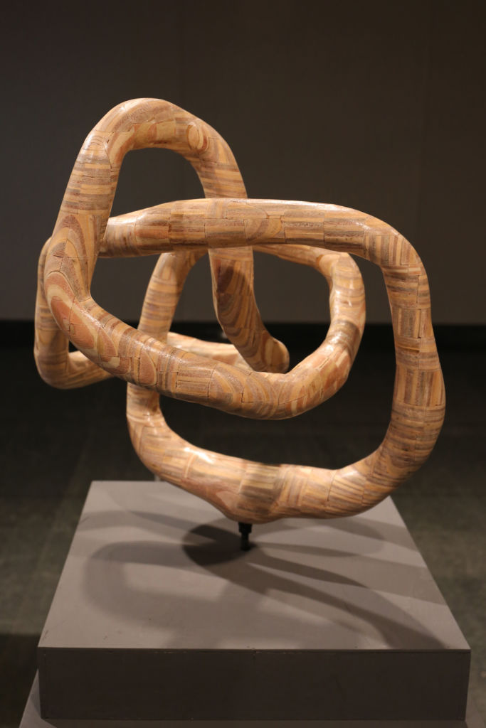 Wooden sculpture by Macau artist Tong Chong. 