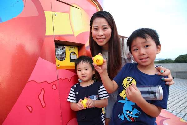 Woman and two kids posing for photo at Nam Wan lake