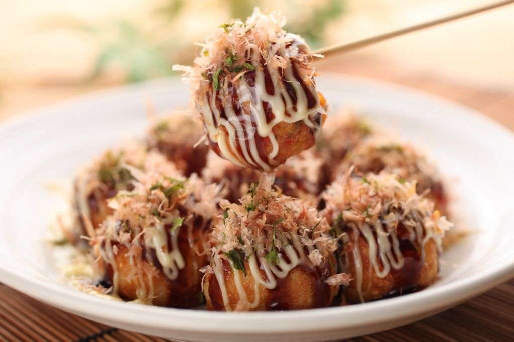A dish of Japanese takoyaki with regular sauce and mayo at the Michelin Guide Street Food Festival in Macau.