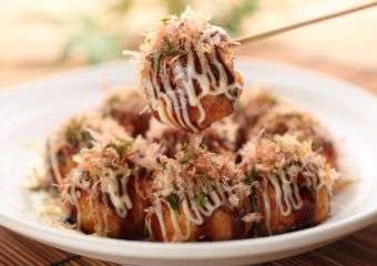 A dish of Japanese takoyaki with regular sauce and mayo at the Michelin Guide Street Food Festival in Macau.
