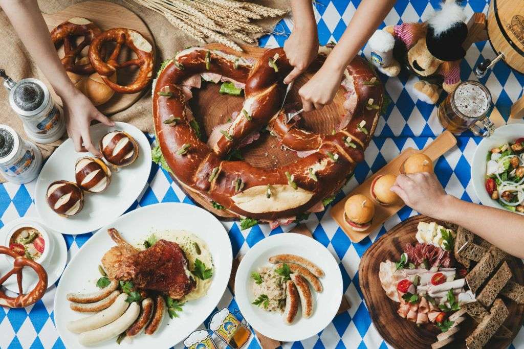 A variety of traditional German dishes displayed on a table at Oktoberfest