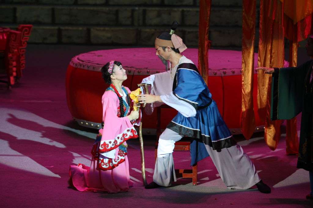 Performers with the Chongqing Acrobatic Art Troupe performing a scene from "Mulan".