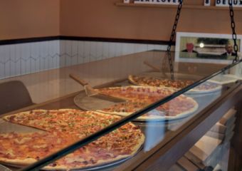 Front counter display of pizzas at Honest Pizzeria in Taipa Macau
