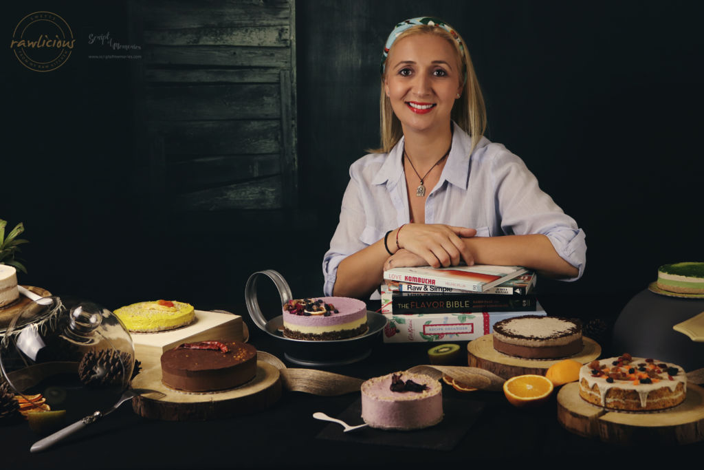 Andreea posing with some of her raw cakes.