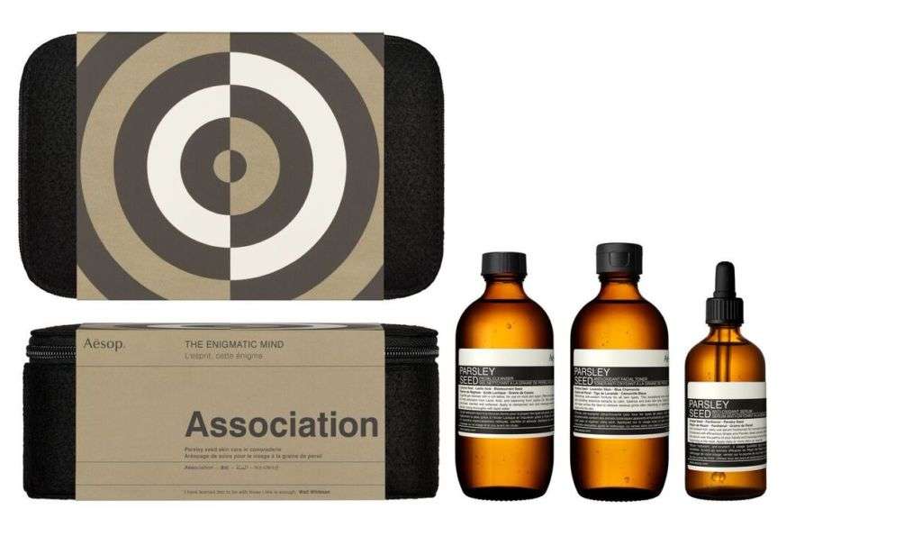 A skin treatment set in three different bottles and a carrying case. 