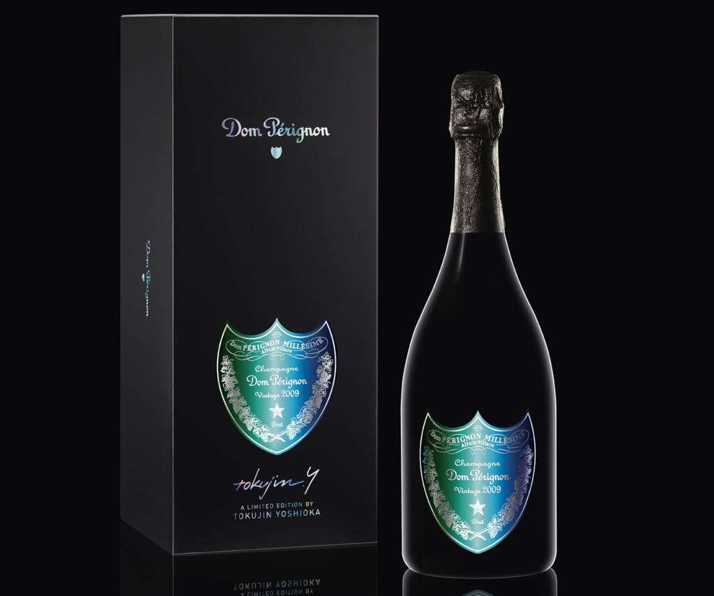 A bottle and the outside box of Dom Pérignon champagne. 