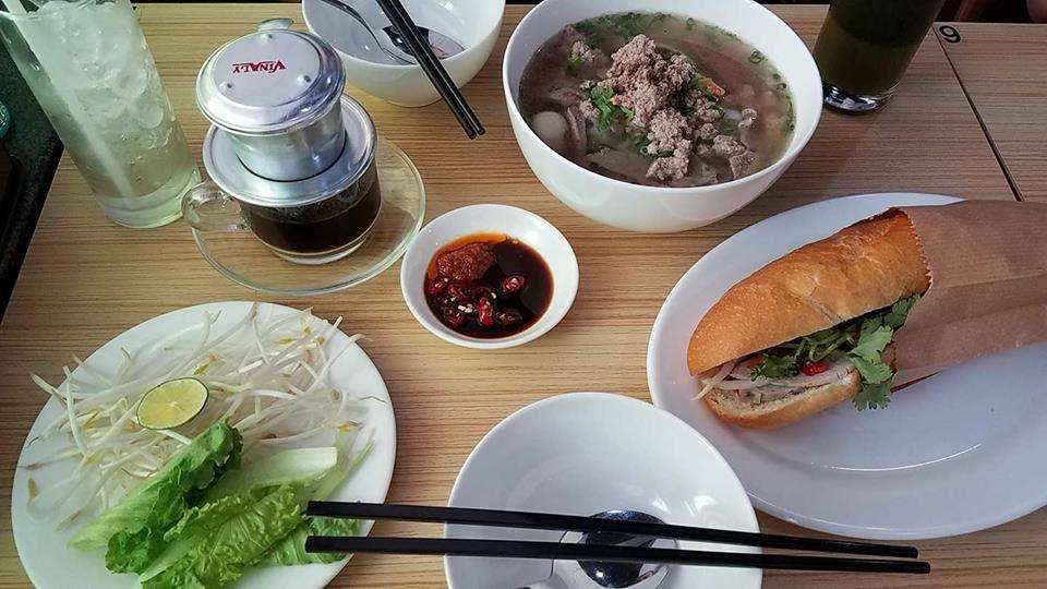 An array of Vietnamese dishes on a table.