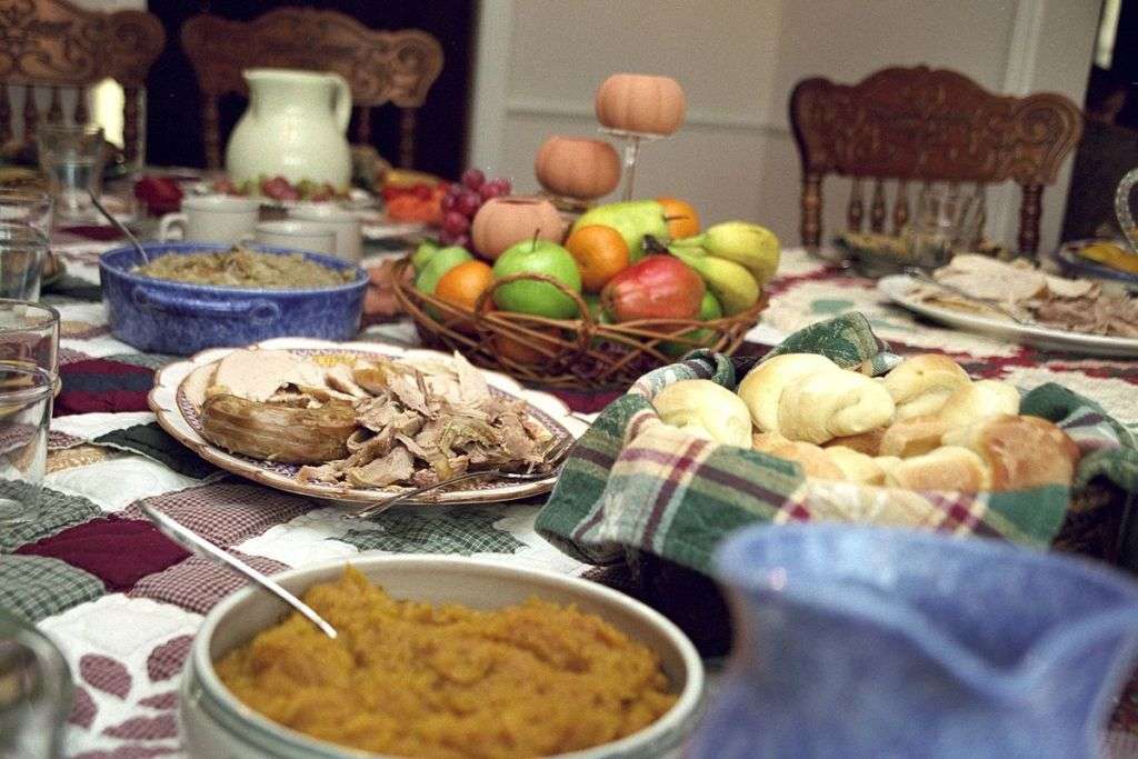 A table laid out with common Thanksgiving side dishes American Thanksgiving holiday