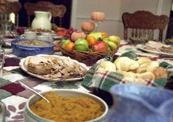 A table laid out with common Thanksgiving side dishes American Thanksgiving holiday