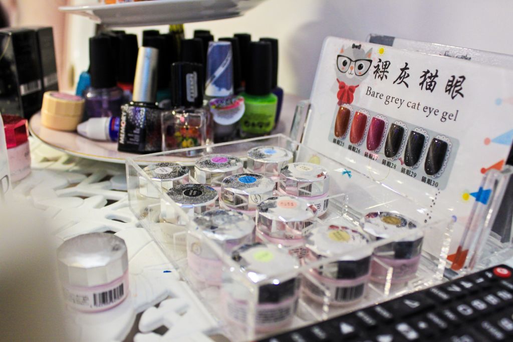 Close up shot of nail polishes and supplies. 