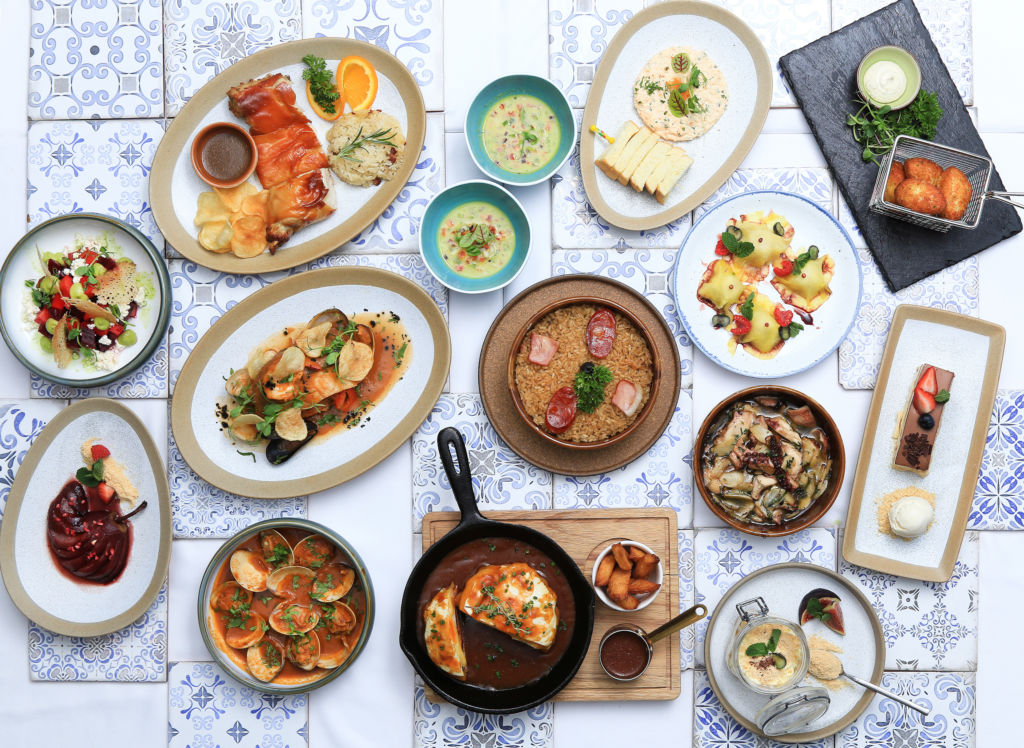 An assortment of Portuguese dishes on a table. 