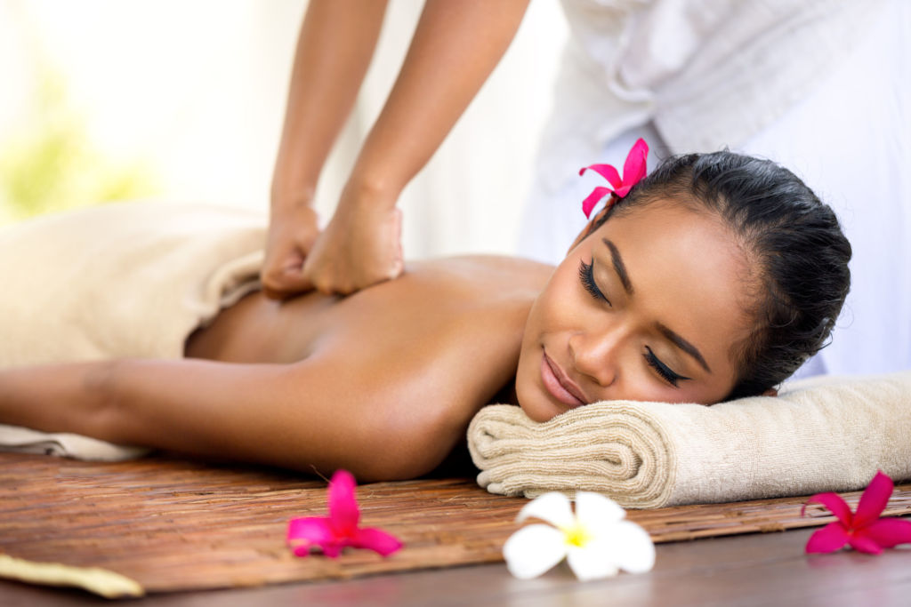 39138677 – balinese massage in spa environment, deep massage of back