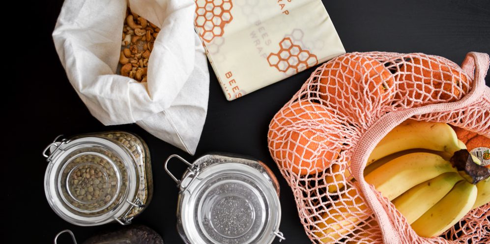 zero waste lifestyle at home beeswax paper fruit in eco bag jars