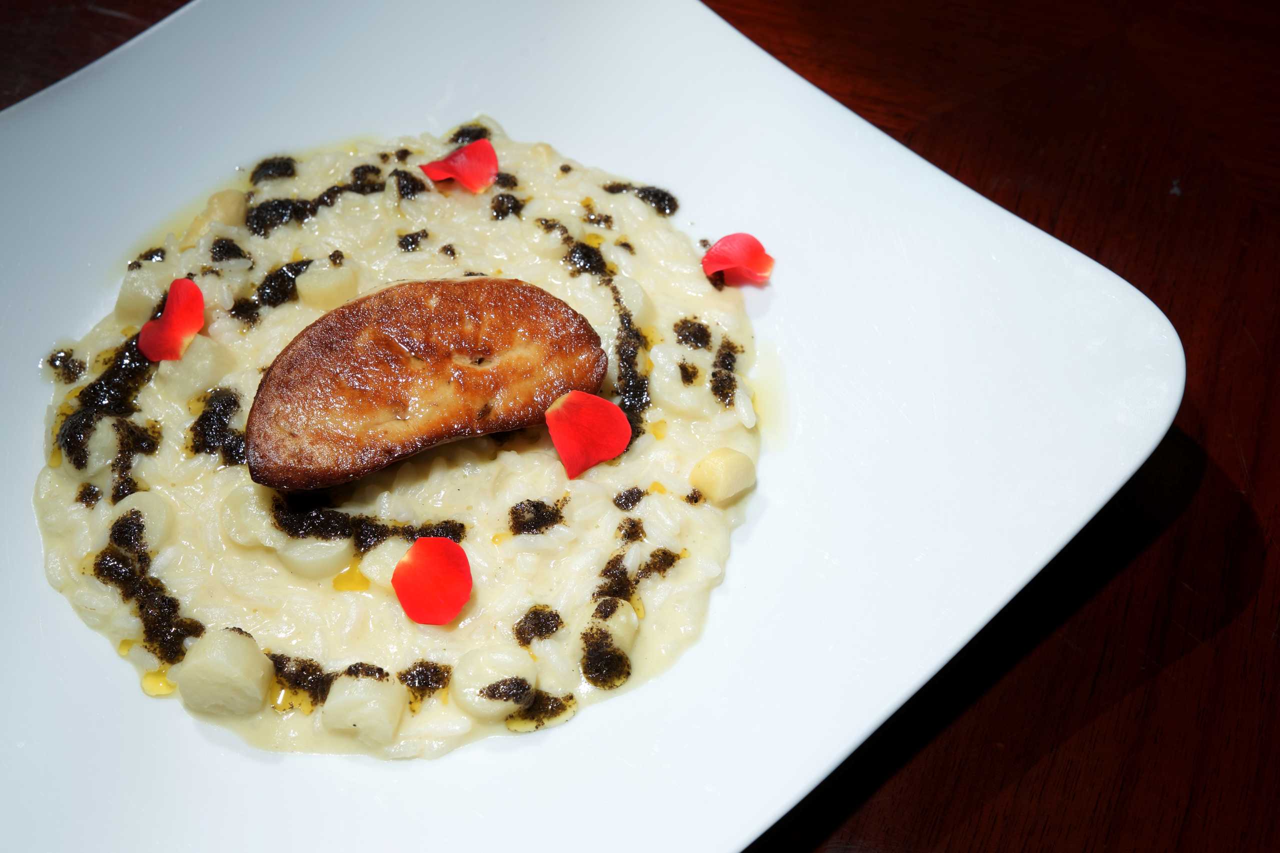 Carnaroli risotto with white asparagus, pan fried duck liver and black truffle sheraton v day