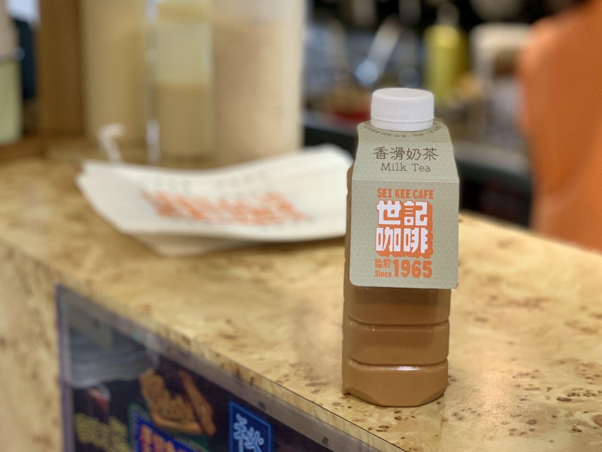 Sei Kee Cafe Milk Tea Bottle on the Counter Macau Lifestyle