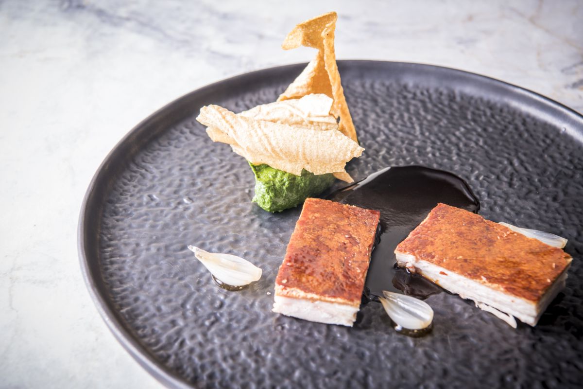 Chiado December Promo Suckling pig confit, turnip top pureee, pickled onions, pepper jus