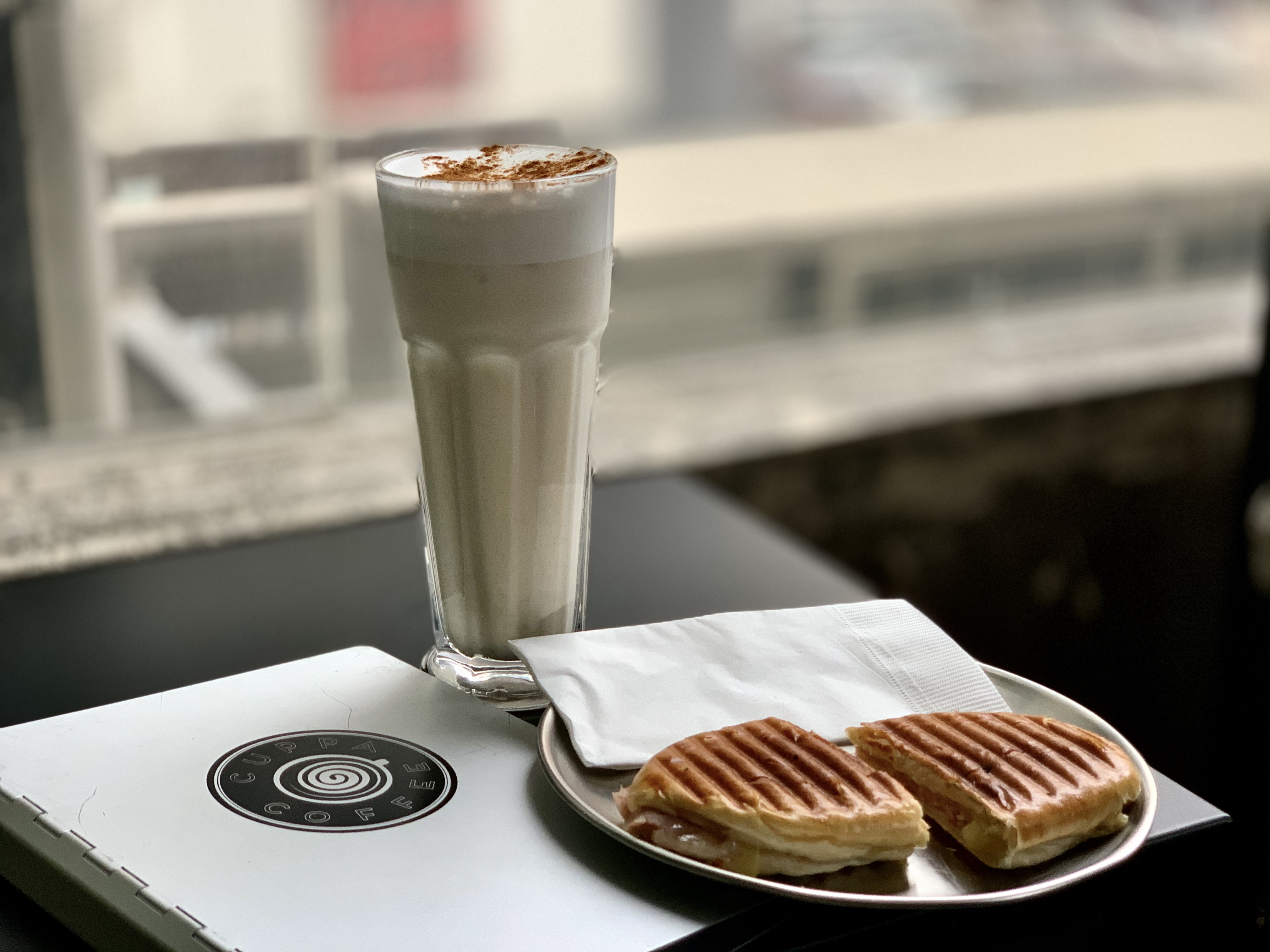 Chai Latte and Portuguese Milk Bun Photo on the Table at Cuppa Coffee Macau Lifestyle