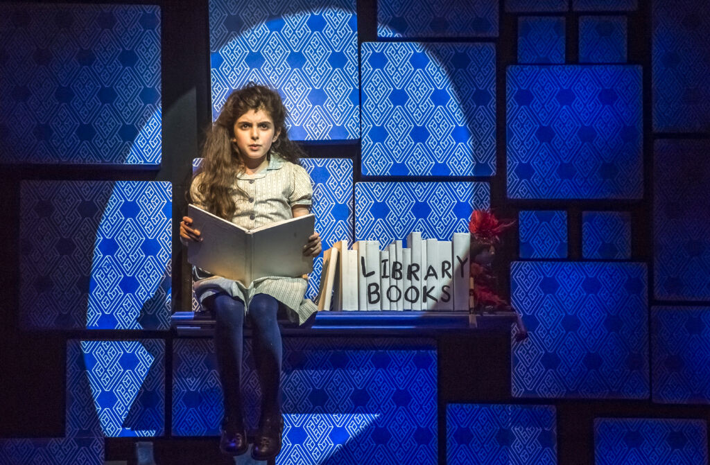 Matilda CCM Main Actress Sitting on Stage