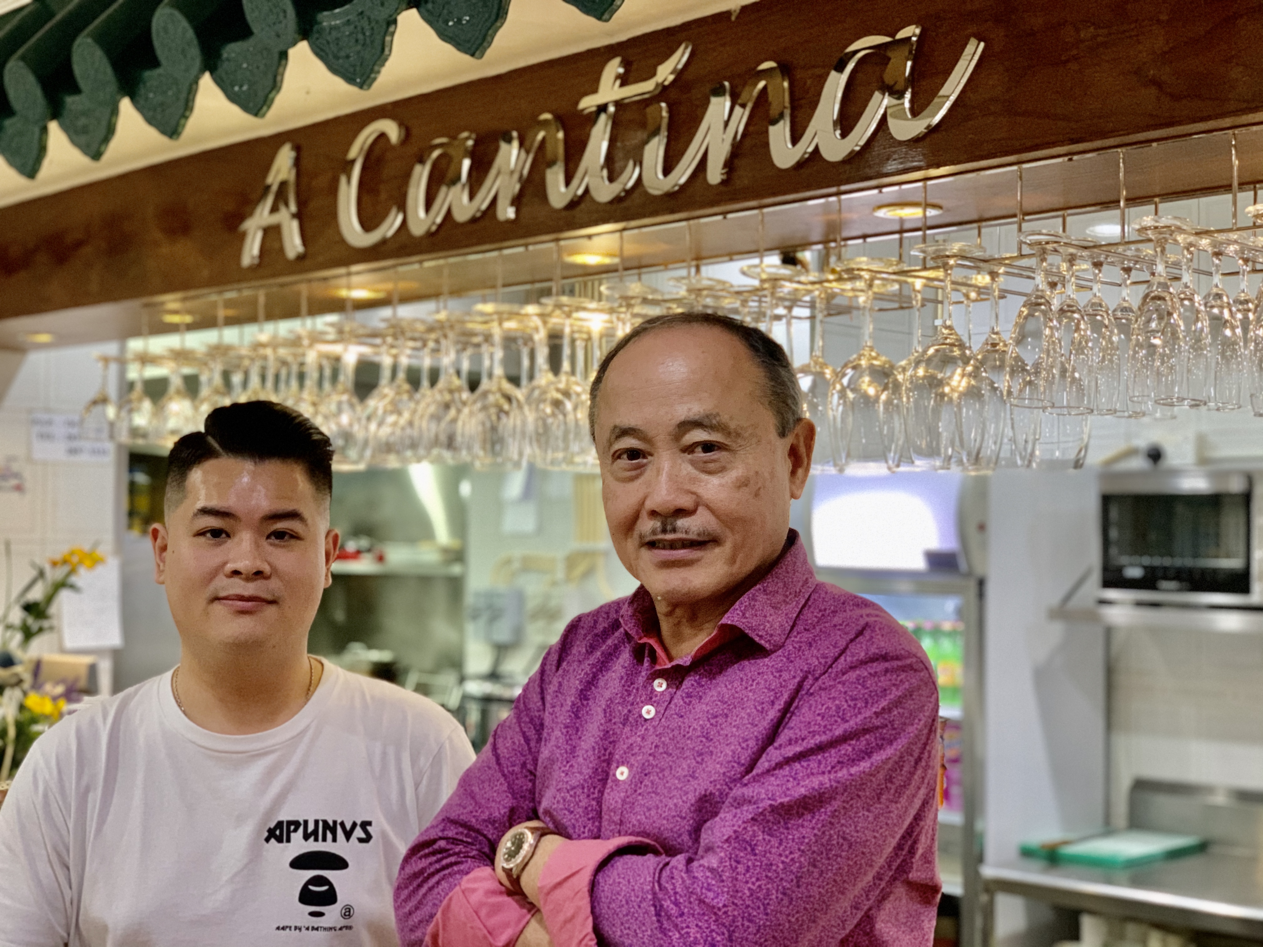 Julio Lei and Jorge Fao at APOMACs canteen counter Macau Lifestyle