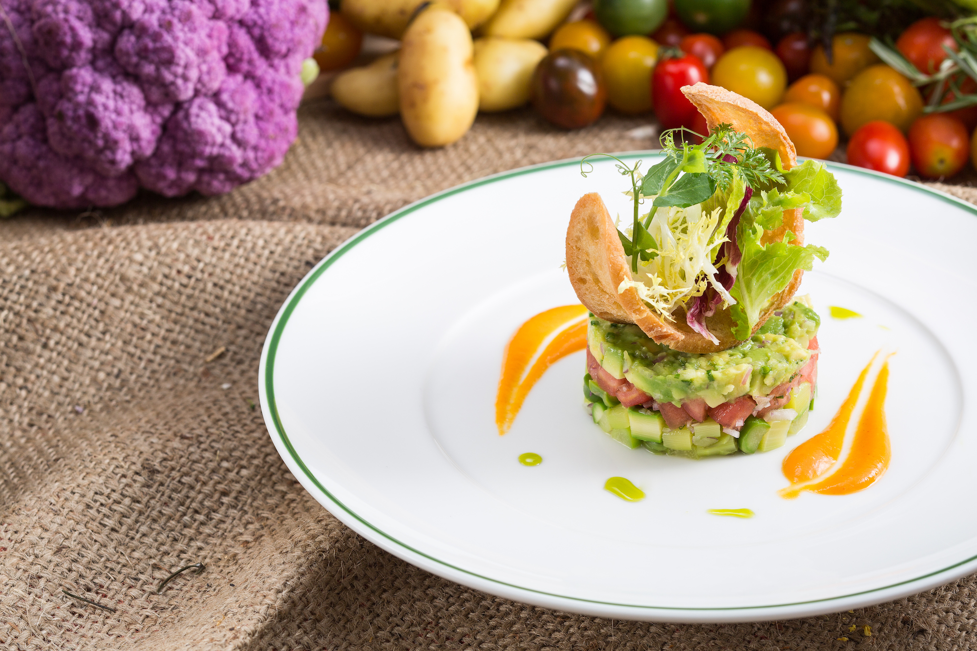 Brasserie the parisian macao Asparagus, avocado and tomato tartare, red bell pepper coulis and crispy greens