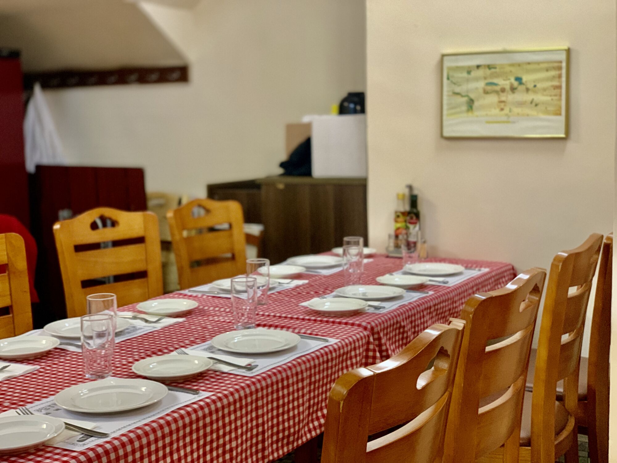 Petisqueira Interior with Painting on the Wall and Table with Chequered Cloth Macau Lifestyle