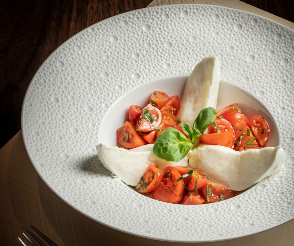 Casa don Alfonso Caprese Salad with fresh buffalo mozzarella, fresh basil and cherry tomato