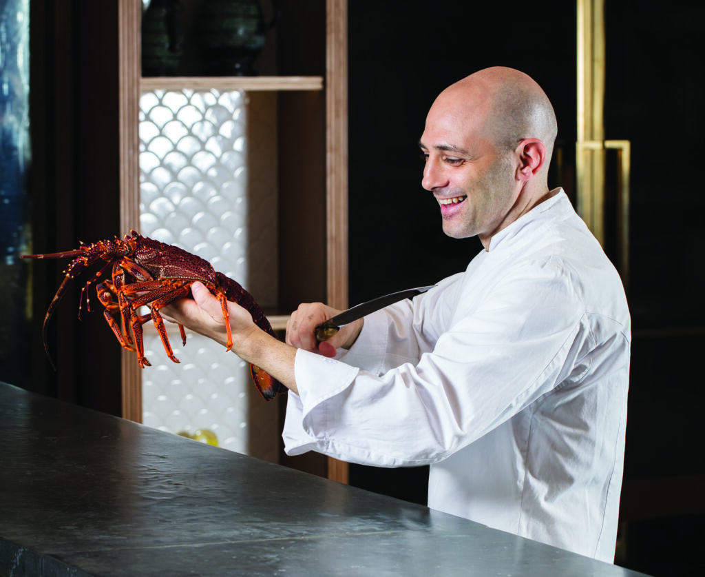 Chef Michele Portrait with Lobster in hand The Manor