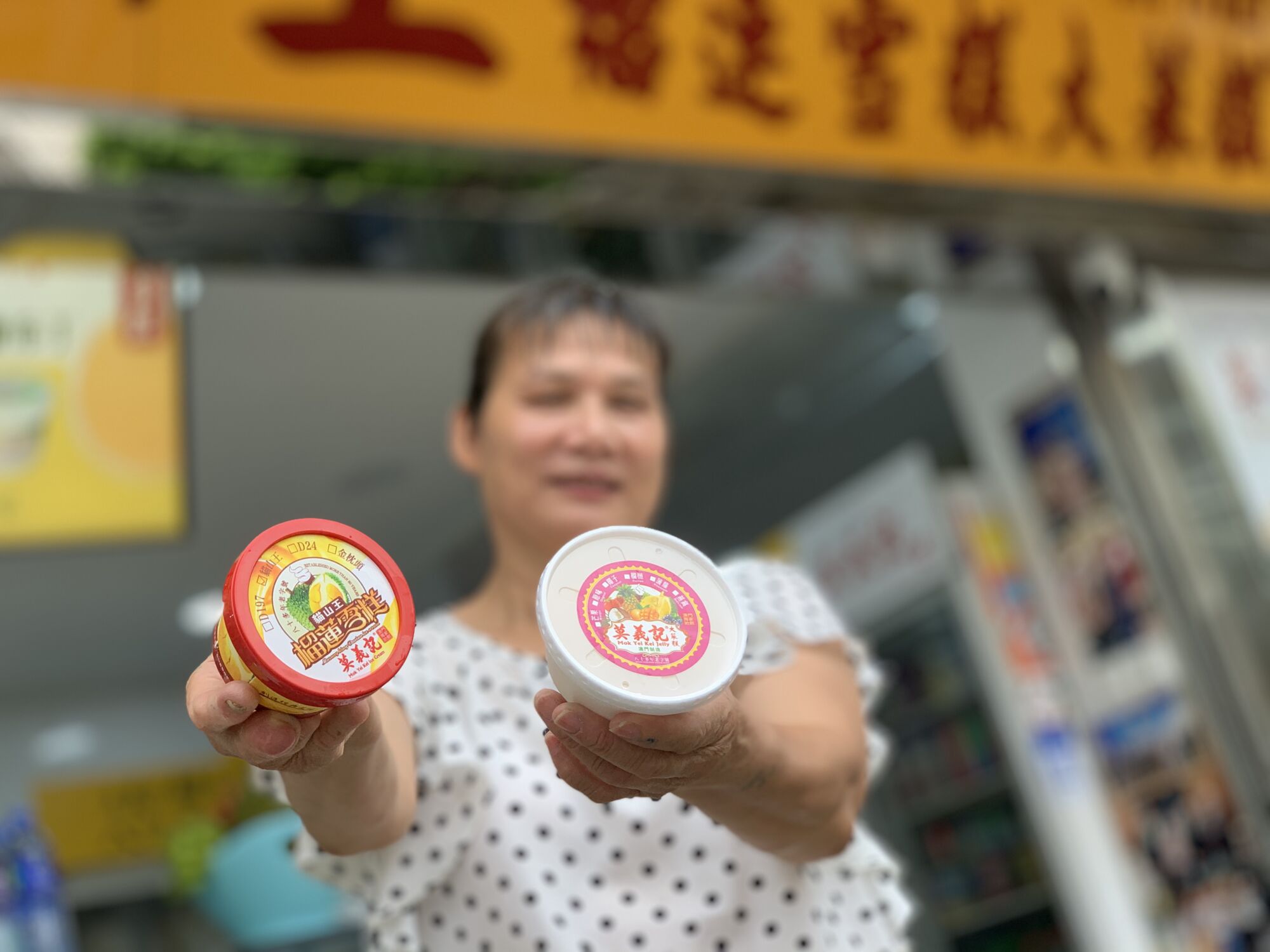 Gelatina Musang Mok Yei Kei Owner Liang Smiling with Ice Cream in Hand Blurred Face Macau Lifestyle