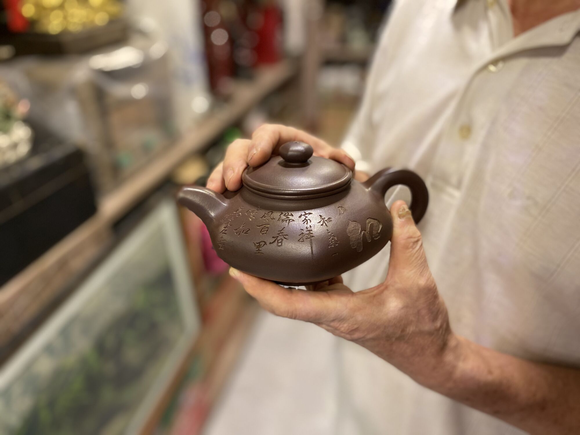 Lei Fong Teapot in Hand centred Macau Lifestyle