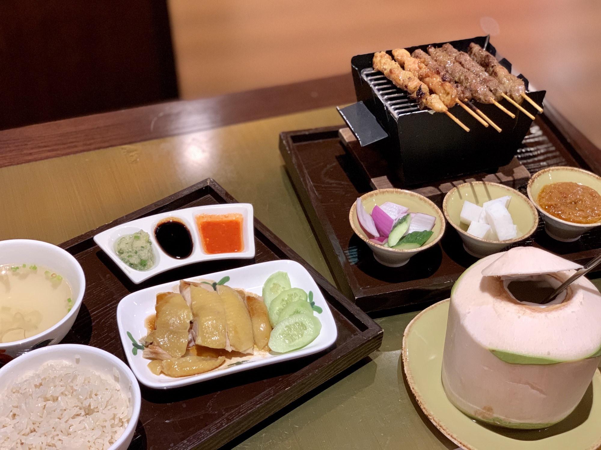 Spice Road Hainanese Chicken on the Left and Malay Assorted Satay Platter with Spicy Peanut Sauce Macau Lifestyle