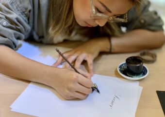Belinda Chim Writing Calligraphy on the Table Macau Lifestyle