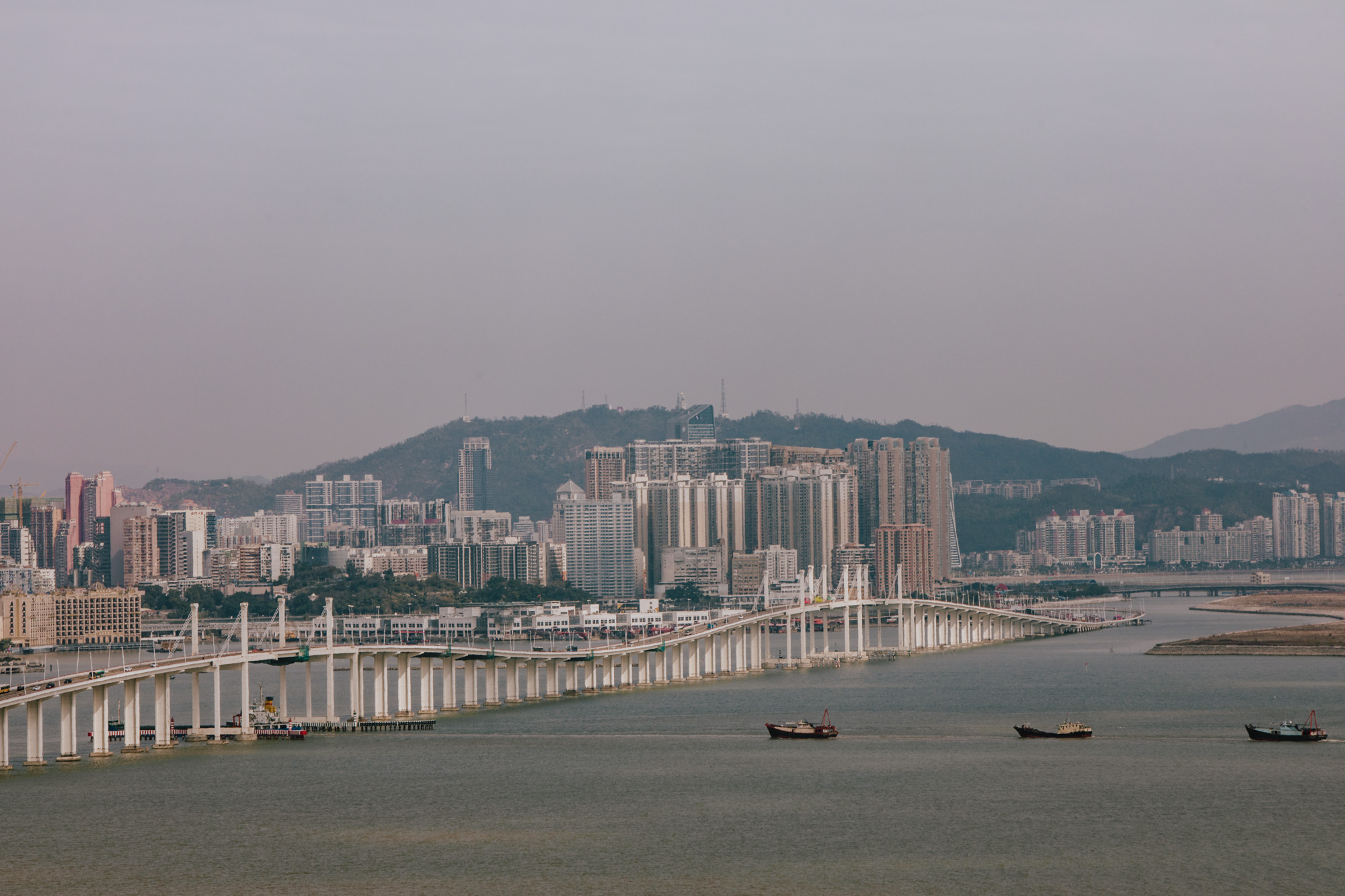 Amizade Bridge (Friendship Bridge) with boats Macau Lifestyle
