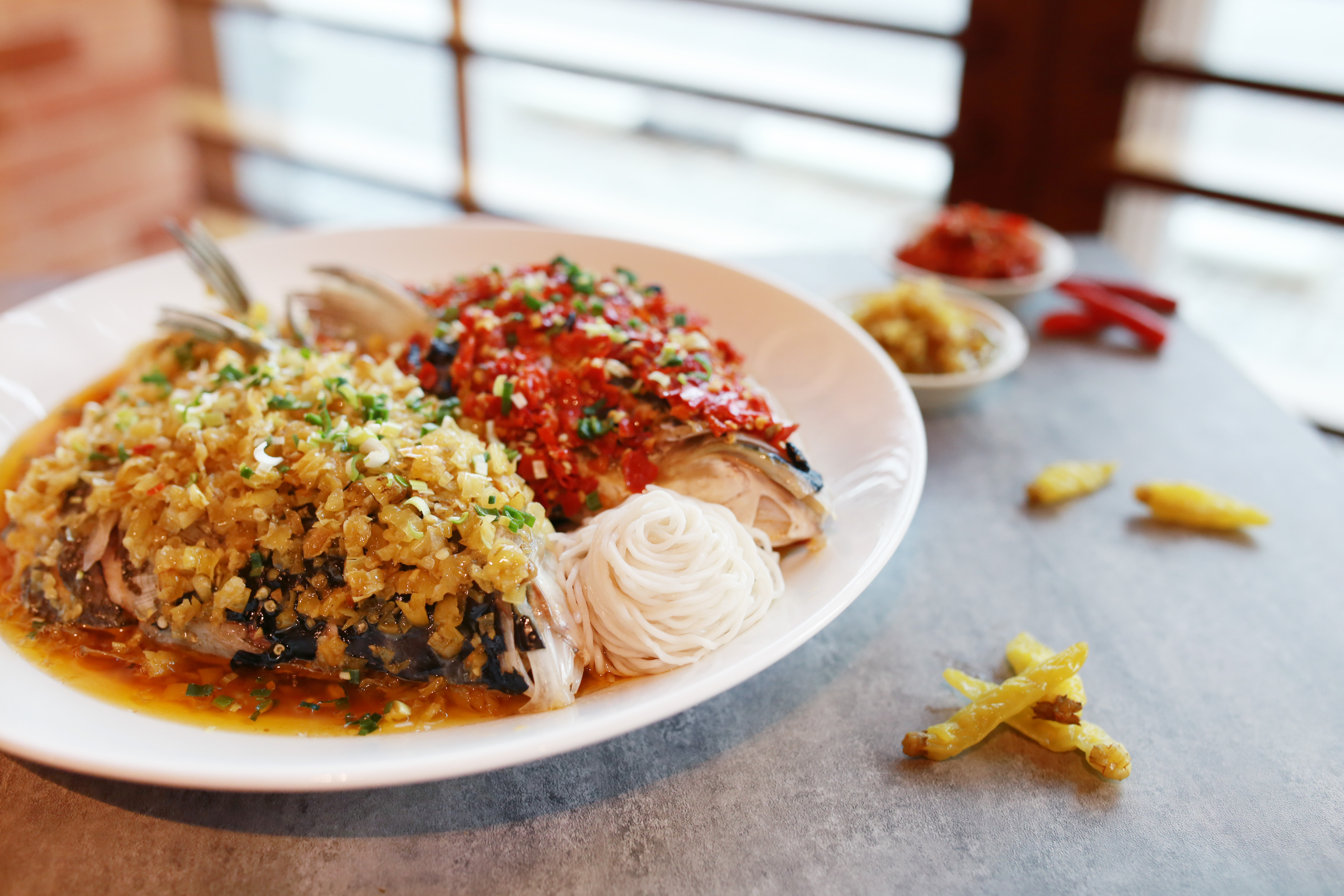 Hunan style steamed fish head, pickled red chili, pickled green chili, garlic, soy sauce Beijing Kitchen Grand Hyatt Macau