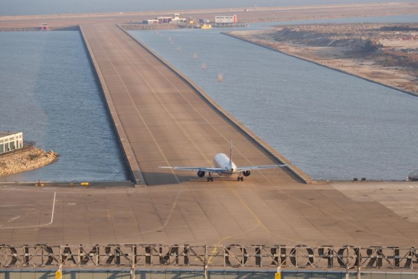 Macau International Airport Landing Strip with Airplane Landing Source Wikipedia