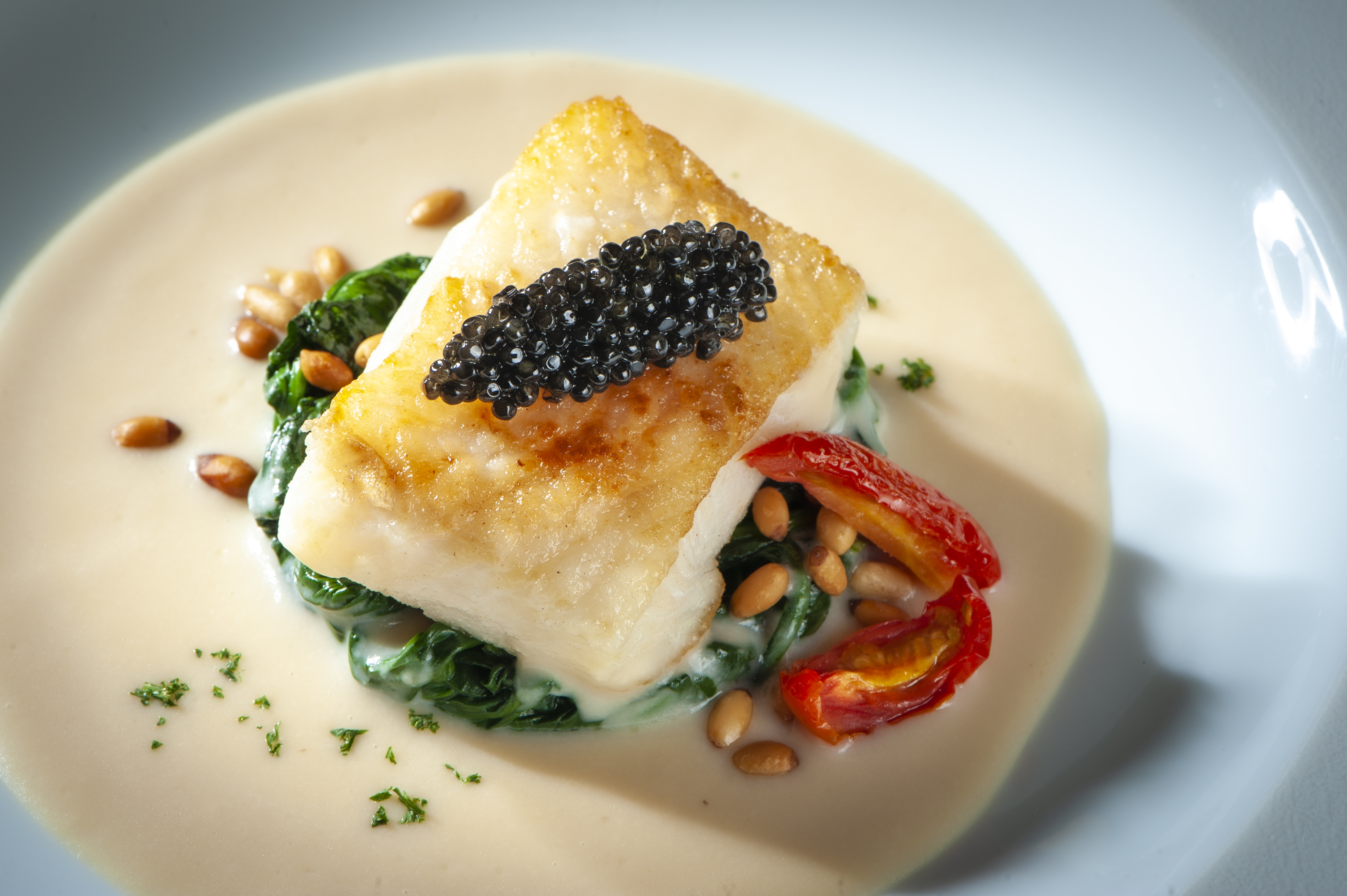 where to Celebrate new year's eve macau 2021 Slow cooked black cod fish with caviar and spinach New Years Eve Dinner Hotel Lisboa